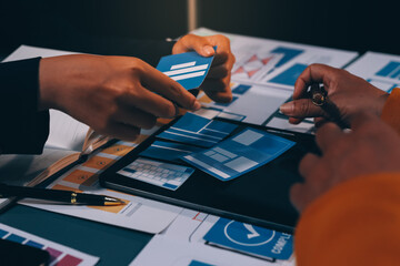 The designer team is designing the uxui system to make the uxui system work well on new phones and support system updates. Website development concept UI UX front end designer