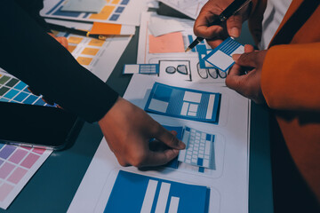 The designer team is designing the uxui system to make the uxui system work well on new phones and support system updates. Website development concept UI UX front end designer