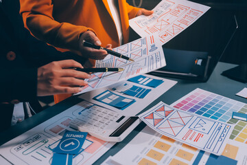The designer team is designing the uxui system to make the uxui system work well on new phones and support system updates. Website development concept UI UX front end designer