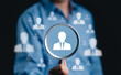 © Supatman - HR, Human resources and recruitment concept. Magnifying glass focused on icon of professional, a symbol human resources, recruitment, and headhunting. identifying, selecting talent for business roles,