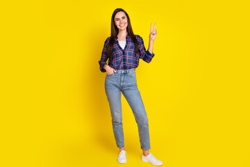 Canvas Print - Full body photo of pretty young girl show v-sign wear trendy plaid outfit isolated on yellow color background