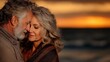 © Anastasiya - A serene scene of a middle-aged couple standing close together on a beach during sunset, sharing an intimate moment, their faces gently touching, with warm golden light in the background