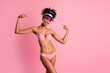 © deagreez - Photo of shiny pretty lady dressed bikini cap showing two fingers herself empty space isolated pink color background