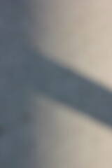 Wall Mural - a vague view of a concrete sidewalk with a shadow.