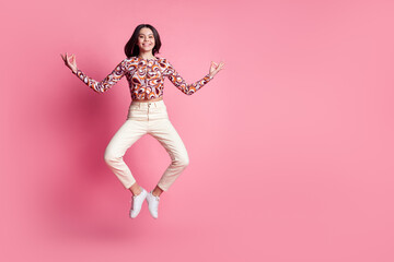 Canvas Print - Photo portrait of teenager hispanic brunette girl jumping in stylish glamour outfit chilling jump retreat yoga isolated on pink color background