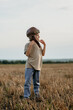 © kohanova1991 - Happy Boy In Aviator Helmet On Nature Meadow, Outside. Kids dream is to be pilot