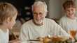 © ryker - joyful family gathering around dinner table, featuring smiling elderly man with two young boys enjoying their meal together. atmosphere is warm and inviting, filled with laughter and love