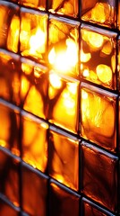   A close-up of a clear glass block wall with a light shining through the center