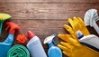 © Matilde - cleaning concept cleaning supplies on wood background