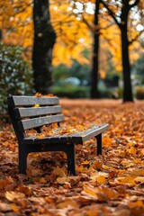 A lonely park bench in the midst of a forest, covered by fallen leaves during the peaceful autumn season.