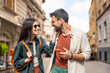 © Srdjan - Beautiful young alternative hipster tourists couple in love walking outdoors at the city street, hugging, wearing modern cool attitude wardrobe. Fashionable and stylish people man and woman enjoy life
