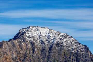 Wall Mural - mountain top and blues sky in liverpool land, northeast greenland national park, the peaks are cover