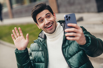 Poster - Photo of nice cheerful glad man blogger streaming video call cold autumn weather outdoors