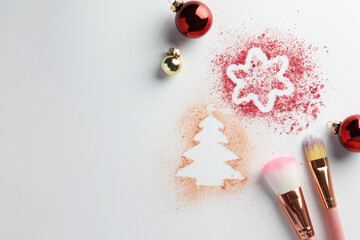 Poster - Christmas decorations made of powder and blush, balls and makeup brushes on white background, flat lay. Space for text