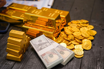 Businessman doing online gold transactions emphasizes the convenience of investing in digital gold. Businessman holds shiny gold bars in office, symbolizing wealth and investment opportunities.