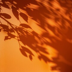 Wall Mural - aesthetic sunlight shadow of tree leaves on the neutral orange wall background