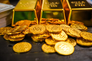 Businessman doing online gold transactions emphasizes the convenience of investing in digital gold. Businessman holds shiny gold bars in office, symbolizing wealth and investment opportunities.