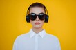 © Matija - cool, modern style woman wearing black sunglasses and headphones and listen to music