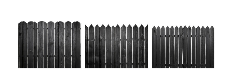 Poster - A black wooden fence with rounded tops stands in front of a blurry white background.