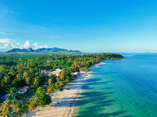 Aerial view sea beach on holiday. People playing in the water, walking on the beach On vacation. Tourist attractions in Thailand with foreigners Come in for a vacation weekend, wave water the blue sea