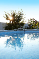 Wall Mural - Above ground swimming pool outdoors on sunny day