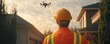 © DonChanu - Construction Worker Watching Drone Inspection of Home
