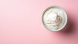 © Mr image - 3. A minimalistic top view of a bowl of sour cream on a subtle pastel background, showcasing the texture and smoothness of the cream, with clear copy space for promotional use
