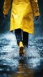 © Kitta Studio - Person in Bright Yellow Raincoat Walking in Rain