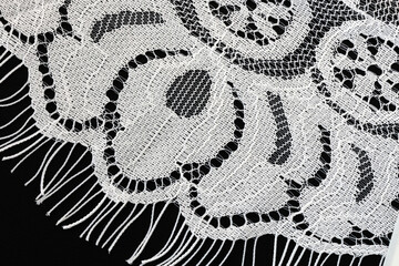 White lace in close up isolated on a black background