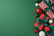 © ActionGP - Top view of beautifully wrapped Christmas presents with green bows and festive decorations on a green background