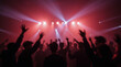 © Dmytriy - The image conveys the atmosphere of a concert with bright lighting and silhouettes of the audience