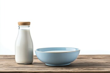 Poster - A glass bottle of milk sits next to a ceramic bowl, ready for use
