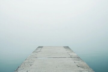 Poster - A concrete pier extends into the water on a foggy day