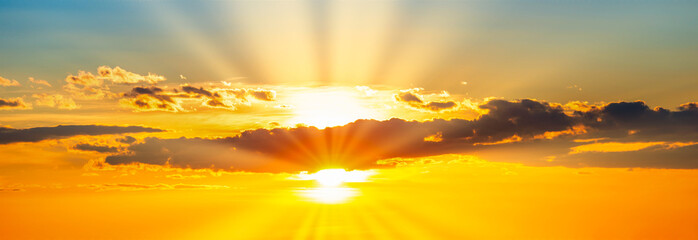 Wall Mural - sunset dramatic sky panorama background with sun and sunset clouds