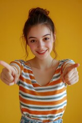 Poster - A young woman points at the camera, making eye contact with the viewer
