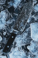 Sticker - A sharp knife sits atop a frozen mountain of ice