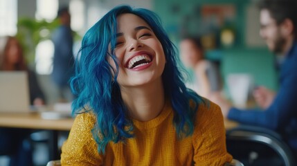 Wall Mural - A smiling woman with bright blue hair sits at a table, perhaps working or socializing