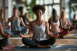 © Micha - Group practicing yoga in a diverse community setting