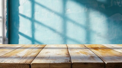 Poster - A rustic wooden table sits empty under the warm sunlight, casting soft shadows on a charming blue wall. Sunlight filters through window blinds, creating intricate patterns