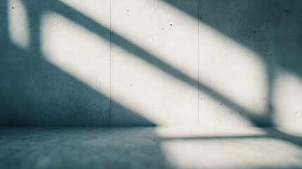 Poster - Soft shadows fall on a smooth concrete wall, highlighting the minimalist nature of the space during the afternoon. The interplay of light creates a calming atmosphere
