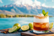 © sharafmaksumov - Close-Up Of A Pisco Sour Cocktail, The National Drink Of Chile, Garnished With A Dash Of Bitters, With A Scenic Backdrop Of The Andes Mountains