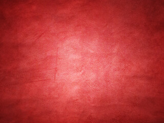 Wall Mural - red suede vignette edge dark and light in the center of the frame.