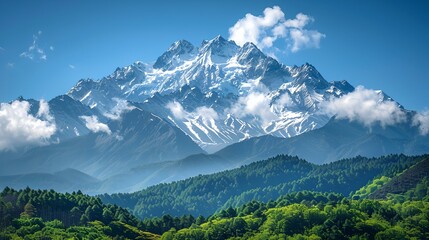 a mountain range with a forest below it