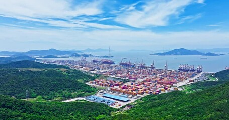 Aufkleber - Aerial shot of cargo container shipping terminal and mountains and seascape