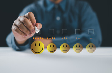 Wall Mural - customer satisfaction and feedback survey concept. a person select happy face, indicating positive f
