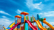 © BURINKUL - A bright and cheerful photograph of a playground filled with colorful slides