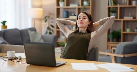 Wall Mural - Home, woman and relax with laptop at desk for remote work, research and done with freelance project. Happy, journalist and smile with documents by technology for success in editing of online article