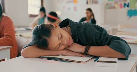 Poster - Tired, sleeping and student on desk in classroom at school with fatigue in lesson for learning. Burnout, rest and girl teenager with nap for exhaustion with education, learning or studying for exam.
