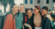 © David/peopleimages.com - Friends, girls and students with backpack laughing together at campus for funny conversation and college joke. University, people and diversity with bonding, learning break and happy for scholarship