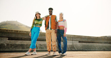 Wall Mural - City, style and group of people with portrait, diversity and cool streetwear on bridge at sunset. Confidence, support and gen z friends with urban fashion, culture and bonding in street together.